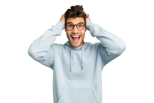 Young caucasian handsome man isolated screaming, very excited, passionate, satisfied with something.