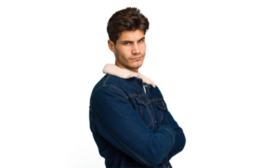 Young caucasian handsome man isolated suspicious, uncertain, examining you.