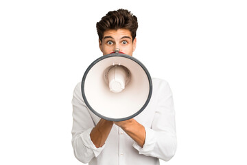 Young caucasian man screaming with a megaphone isolated