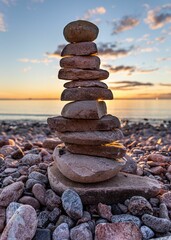 Vertical shot of zen stones at Sweden Eastcoast on Baltic sea at sunset
