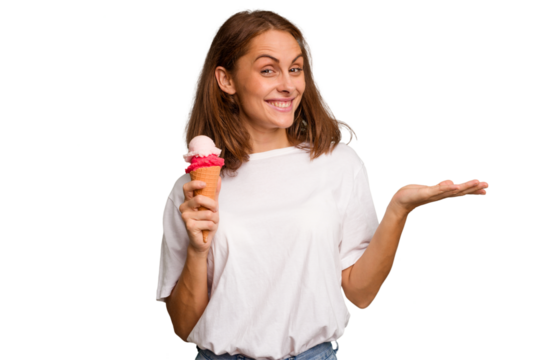 Young caucasian woman holding an ice cream isolated showing a copy space on a palm and holding another hand on waist. - Powered by Adobe