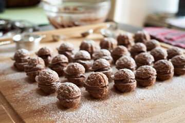 Cocoa Christmas cookies in the form of nuts on a kitchen table