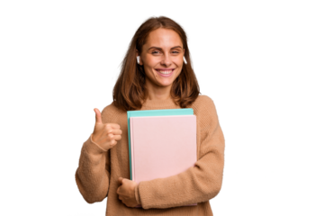 Young student woman holding a books isolated smiling and raising thumb up