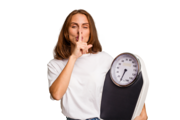 Young caucasian woman holding a scale and measure tape isolated keeping a secret or asking for silence.