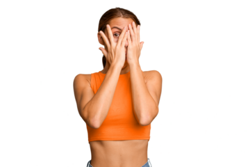 Young caucasian woman isolated blink through fingers frightened and nervous.