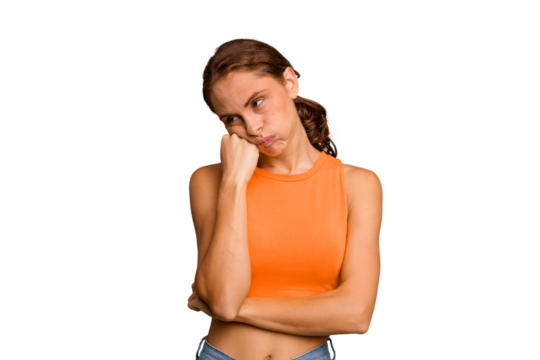 Young caucasian woman isolated who feels sad and pensive, looking at copy space.