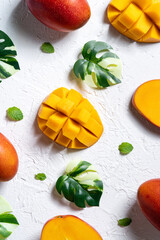 Mango background design concept. Top view Diced fresh mango fruit on white table.