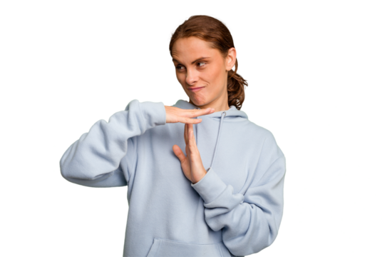 Young caucasian woman isolated showing a timeout gesture.