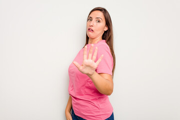 Obraz premium Young caucasian cute woman isolated on white background being shocked due to an imminent danger
