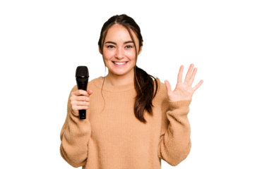 Young caucasian singer woman isolated on green chroma background smiling cheerful showing number five with fingers.