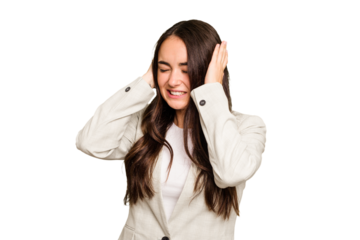 Young caucasian woman isolated on green chroma background covering ears with hands.