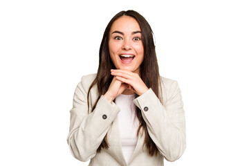 Young caucasian woman isolated on green chroma background praying for luck, amazed and opening mouth looking to front.