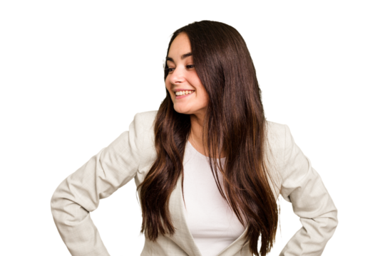 Young caucasian woman isolated on green chroma background laughs happily and has fun keeping hands on stomach.