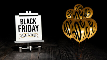Black Friday Sale banner with gold balloons on wooden table top