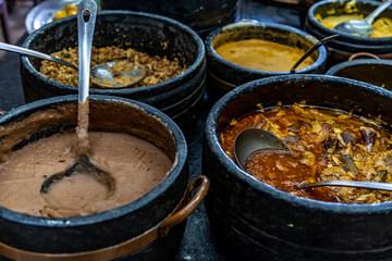 roast meat in a pot on the dinner table