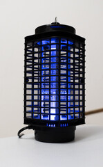 Violet light mosquito lamp. Insect killer (lantern) with blue light. Protect the mosquito