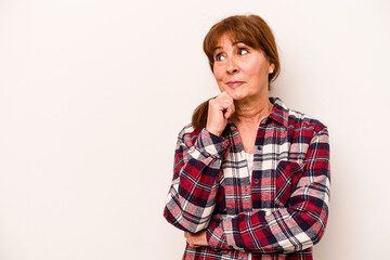 Middle age caucasian woman isolated on white background looking sideways with doubtful and skeptical expression. - obrazy, fototapety, plakaty