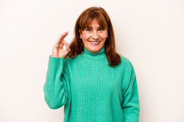 Middle age caucasian woman isolated on white background cheerful and confident showing ok gesture.