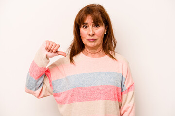 Middle age caucasian woman isolated on white background showing a dislike gesture, thumbs down....
