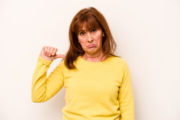 Middle age caucasian woman isolated on white background showing a dislike gesture, thumbs down. Disagreement concept.