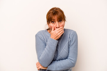 Middle age caucasian woman isolated on white background scared and afraid.