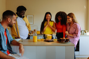 Friends celebrate birthday at home.
