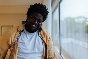 African American man in apartment.