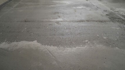 Filling the floor with concrete, screed and leveling the floor. Smooth floors made of cement mix,...