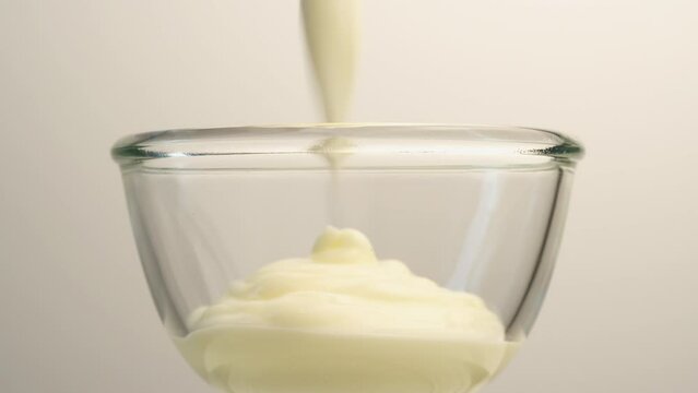 Close-up of yogurt poured into a glass cup food supplement Staying healthy has no calories.
