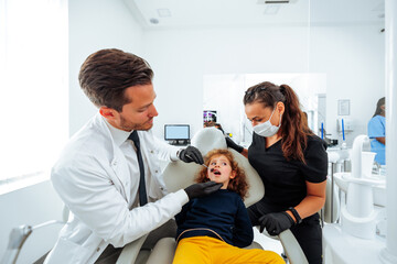 Child has procedure at dentist.