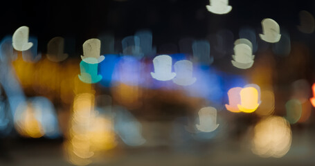 Abstract blur Christmas lights bokeh topper background at night. Topper style bokeh on holiday...