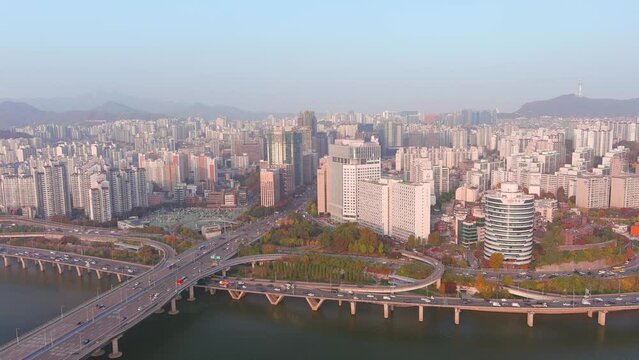 Seoul: Aerial view of capital city of South Korea, skyline of Hapjeong-dong with modern buildings (skyscrapers) at sunset, tree foliage in autumn colors - landscape panorama of East Asia from above