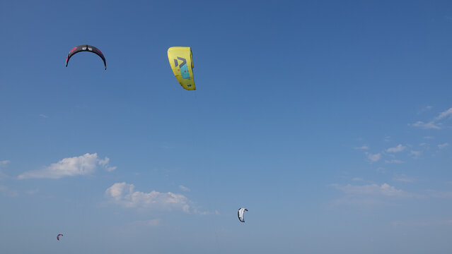 Kite Surfers in action on Waves in sea. Kitesurfs make slalom on the waves. Serial images Imbros Island. Gokceada, Canakkale Turkey 08.20.2022