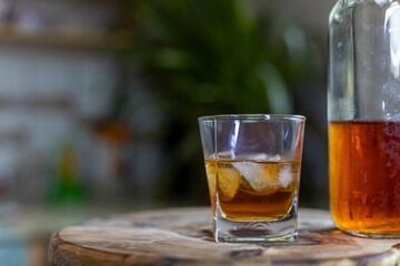 Close-up of a glass of whiskey with ice cubes