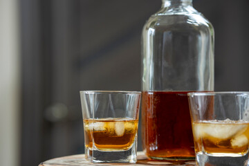 Close-up of a glass of whiskey with ice cubes