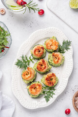Cucumber Avocado Shrimp Appetizer. Canape with prawn, cucumber and guacamole, party food, finger food - obrazy, fototapety, plakaty