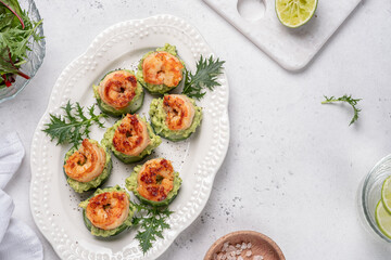 Cucumber Avocado Shrimp Appetizer. Canape with prawn, cucumber and guacamole, party food, finger food