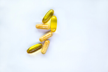 Vitamis B and Omega3 on white background