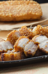 crispy pork belly deep fried pork or Chinese roasted pork belly on a wooden chopping board. close-up shot