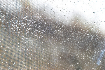 raindrops left on the glass after a rainstorm