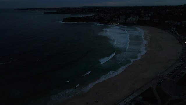 Drone shot of Bondi beach at night. Ocean and sea stock videos.