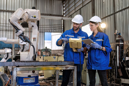 In Robotic Training Center Instructor Use Tablet Pc Teach Girl Engineer How To Program Robot Arm