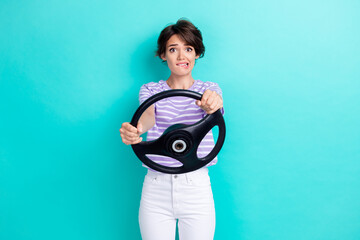 Photo of staring gorgeous girl with bob hairstyle dressed striped t-shirt hold steering wheel bite...