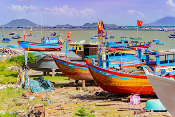 Fototapeta na wymiar Fishing boats on the shore. Vietnam, Doclet, near Nha Trang. Fishing village. 
