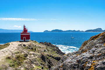 Red lighthouse in Punta Robaleira, Costa da Vela, Pontevedra, Galicia, Spain