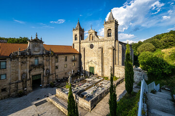 The romanesque gothic monastery of Santo Estevo de Ribas de Sil at Nogueira de Ramuin, Galicia in Spain - obrazy, fototapety, plakaty