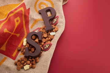 Dutch holiday Sinterklaas background with traditional sweets and chocolate letter.