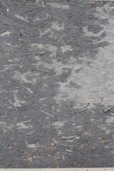 Texture of plywood with a peeled coat of paint.