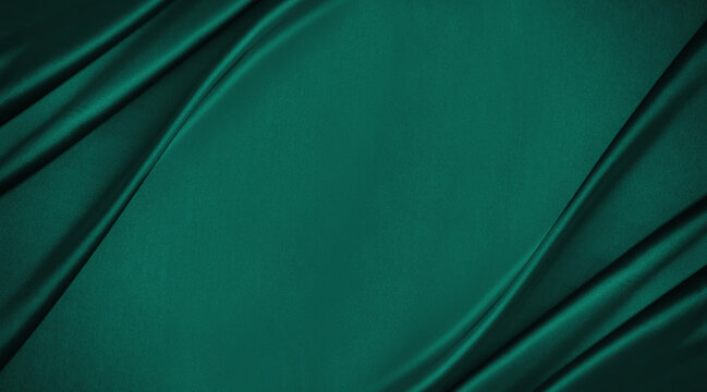Dark teal green silk satin. Shiny smooth fabric. Soft folds. Luxury background with space for design. web banner. Flat lay, top view table. Birthday, Christmas, Valentine, New year.