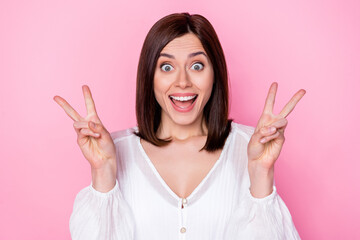 Photo portrait of cute young lady excited show double v-sign fingers shiny smile wear trendy white...